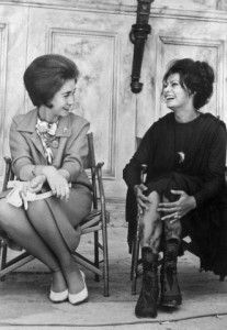 29 May 1963, Madrid, Spain --- Original caption: Princess and the movie Queen. Italian film star Sophia Loren (right) breaks into laughs as she explains use of special leg make-up to Princess Sophia of Greece when the latter visited the set of The Fall of The Roman Empire, here May 29th. The special make-up is being used in the final scenes of the Samuel Bronston-produced filmed epic. --- Image by © Bettmann/CORBIS