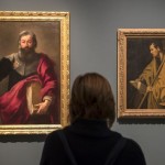 epa05621376 A visitor looks at two paintings displayed in the exhibition 'Velazquez. Murillo. Sevilla' during its press preview at the Focus Foundation headquarters in Seville, Spain, 07 November 2016. The exhibition marking the 4th century of Spanish artist Bartolome Esteban Murillo (1617-1682) will run until 28 February 2016.  EPA/JULIO MUNOZ