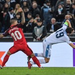 Sevilla's Argentine midfielder Ever Banega (L) tackles Lazio's Bosnian midfielder Senad Lulic during the UEFA Europa League round of 16 first leg football match Lazio Roma vs Sevilla on February 14, 2019 at the Olympic stadium in Rome. (Photo by Tiziana FABI / AFP)        (Photo credit should read TIZIANA FABI/AFP/Getty Images)